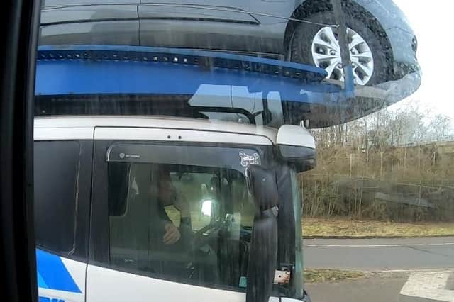 Police officers overtaking this heavily-laden car transporter were shocked to discover the driver was using just one elbow to control the huge vehicle as he travelled along the M40 near Gaydon.