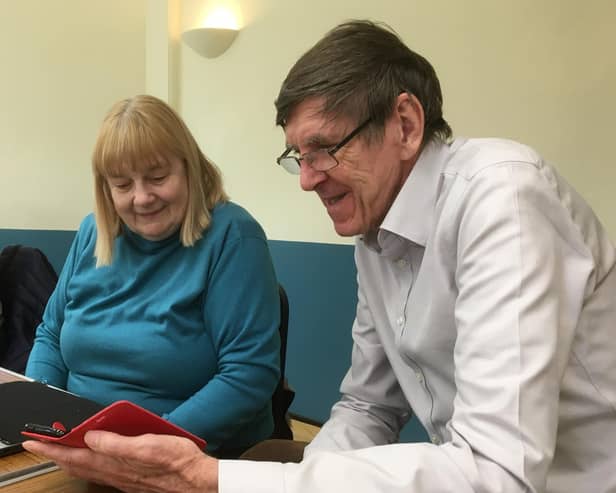 Computer Café volunteer John Morgan helps Janina Stanway with I.T. Photo supplied