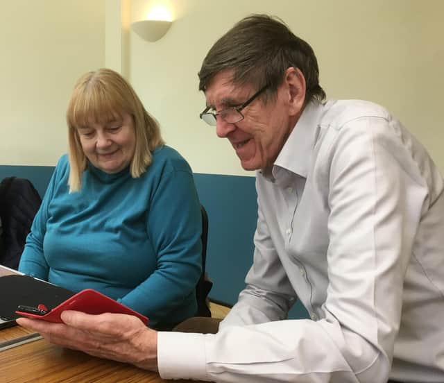 Computer Café volunteer John Morgan helps Janina Stanway with I.T. Photo supplied