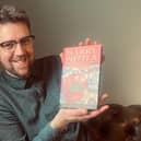 Harry Potter books expert Jim Spencer with the first edition. Photo by Rare Book Auctions