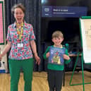 Author Louie Stowell delivering Shakespeare Martineau-donated books to St Lawrence Primary School