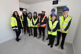 The Bellway staff and pupils and teacher in the House to Home plot.
