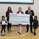 Corina O’Brien, from Mary’s Meals, receives the cheque from Headmaster Rob Duigan and pupils from Crackley Hall School. Left to right - Nirvair Sanghera, Corina O’Brien, Lily Bryson, Rob Duigan and Marley Dabo. Photo supplied