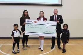 Corina O’Brien, from Mary’s Meals, receives the cheque from Headmaster Rob Duigan and pupils from Crackley Hall School. Left to right - Nirvair Sanghera, Corina O’Brien, Lily Bryson, Rob Duigan and Marley Dabo. Photo supplied