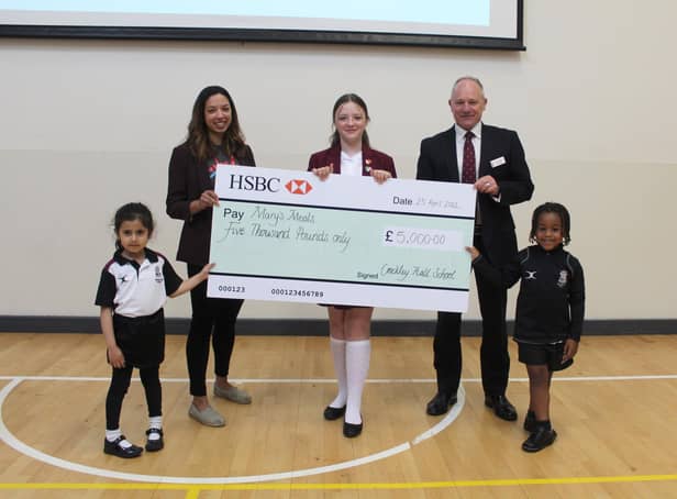 Corina O’Brien, from Mary’s Meals, receives the cheque from Headmaster Rob Duigan and pupils from Crackley Hall School. Left to right - Nirvair Sanghera, Corina O’Brien, Lily Bryson, Rob Duigan and Marley Dabo. Photo supplied