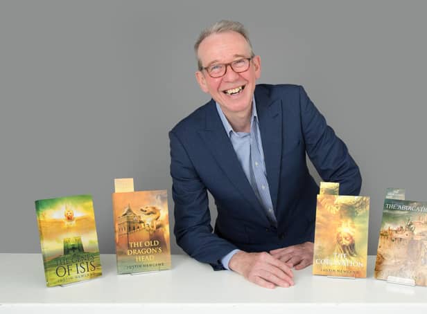 Dr Justin Newland with his novels. Photo by Christopher Alan.
