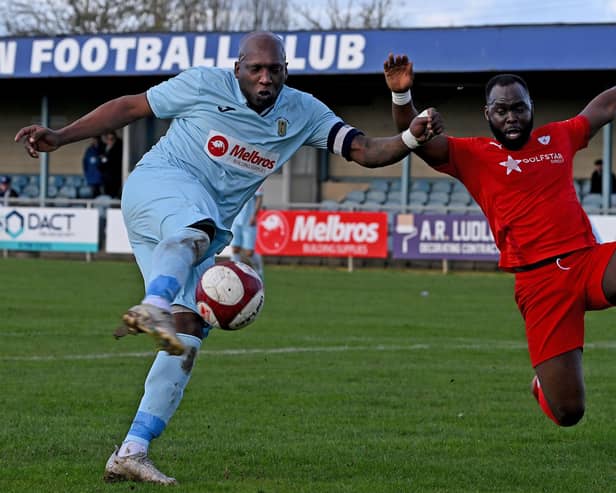 Skipper Michael Taylor gets a shot off for Rugby Town against Coleshill Town (Picture: Martin Pulley)