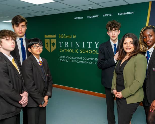 Samirah Roberts, Trinity Catholic School's leader and improvement lead, with pupils at the school. Photo by Mike Baker