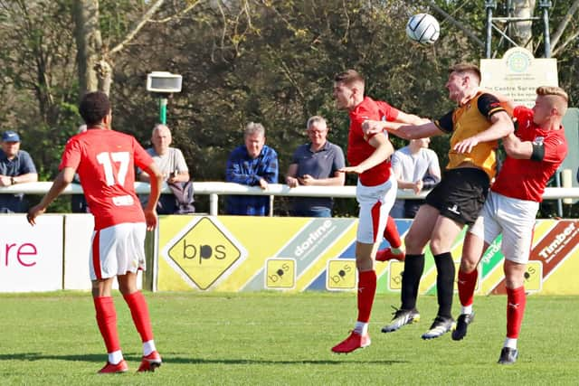 Jack Edwards wins an aerial battle with Brackley