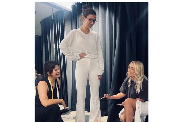 Sky Sports presenter and volunteer model Kate Tracey sports one of the bespoke pieces pictured with Hattie and Gemma. Photo supplied