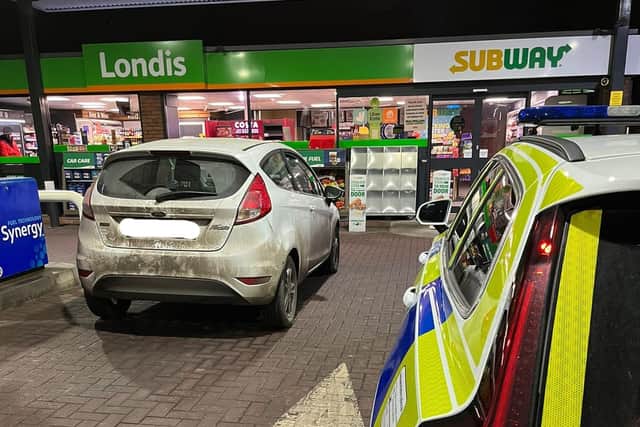 The vehicle stopped at the Esso petrol station where officers arrested the driver - but the passenger was not hanging around.