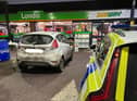 The vehicle stopped at the Esso petrol station where officers arrested the driver - but the passenger was not hanging around.