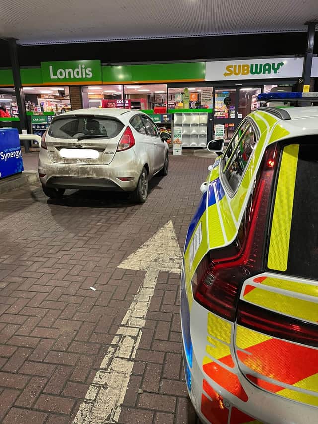 The vehicle stopped at the Esso petrol station where officers arrested the driver - but the passenger was not hanging around.