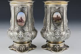 A pair of silver and enamel vases showcasing important Warwickshire landmarks, will be going up for auction. Photo by Kinghams Auctioneers & Valuers Ltd