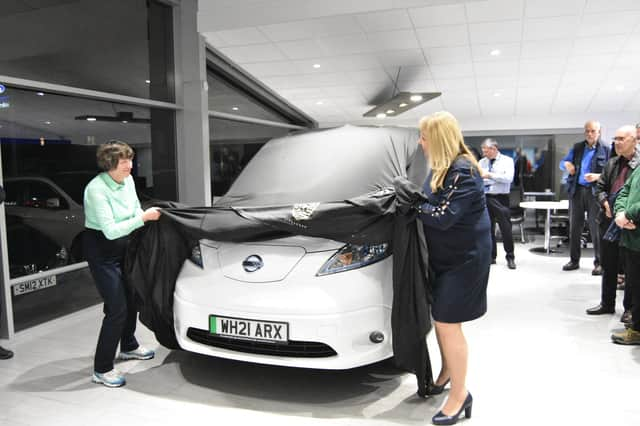 Janette Ackerley and Rosita Page unveiling vehicle