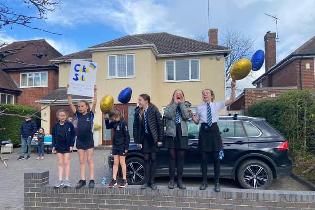 Daisy and Lucia, in year 8 at North Leamington School, held a bake sale to raise money for Unicef's Ukraine Appeal. They raised almost £700 for the cause. They are pictured here getting some help from their friends to advertise the sale.