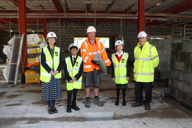 Left to right: history teacher Tracey Hester, Year 7 Krishan Patel, Trendrey site manager Kevin Wynne, Year 7 Lauren Dent, and foundation assistant Head Alex Darkes. Photo supplied