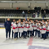 Rhodes Mitchell-King holds the silver trophy along with his Great Britain team-mates