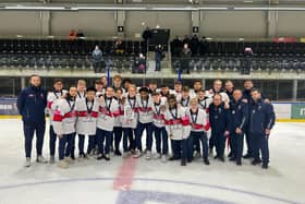 Rhodes Mitchell-King holds the silver trophy along with his Great Britain team-mates