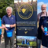 Aaron Coleman from Parkinson’s UK accepts the cheque from Ian Jamie, John Nichols and Lydia Haley from Warwickshire Lavender Farm