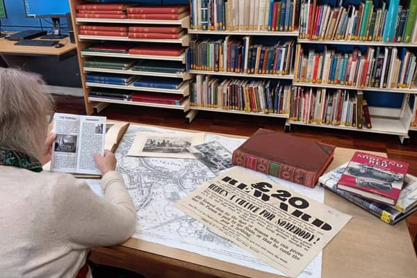 a researcher using the library local studies resources