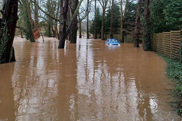 This BMW driver found out the hard way that flood alerts have been issued across the Warwick district. (Photo by Kenilworth and Warwick Rural Police)