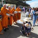 Thai traders give gifts to Buddhist Monks