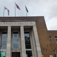 Rugby Borough Council: Staff emptying buckets from roof leaks at retirement flats