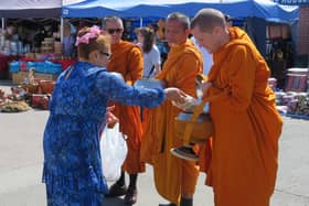 The Buddhist monks receiving gifts at the Warwick Thai Festival. Photo supplied