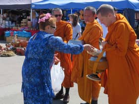 The Buddhist monks receiving gifts at the Warwick Thai Festival. Photo supplied