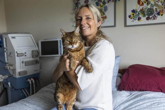 Maddy Warren , with her pet cat Archie, who is nominated in the 'Most Caring Cat' category in this year's Cats Protection National Cat Awards, sponsored by Purina. Picture date: Friday May 13, 2022, 2021. PA Photo. Photo credit: Fabio De Paola/PA Wire