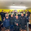 Paul Holleran with his Manager of the Month award and some of Leamington's staff and players.