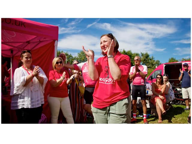 Rachel Ollerenshaw welcoming the riders at the finish line. Photo by Dave Fawbert