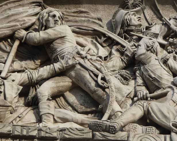 Napoleon leading the charge at the Battle of Arcole in 1796 (detail from the Arc de Triomphe)
