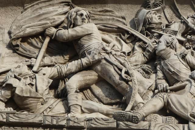 Napoleon leading the charge at the Battle of Arcole in 1796 (detail from the Arc de Triomphe)
