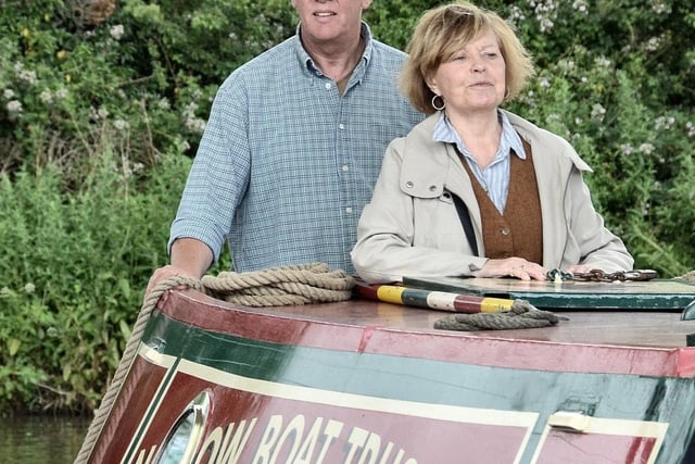 Actress and canal enthusiast Prunella Scales on the Brighton in the 2017 Parade of Historic Narrowboats, assisted by Colin Wilks of the Narrow Boat Trust.
