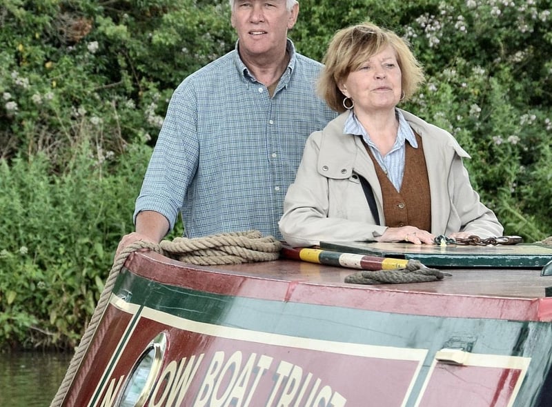 Actress and canal enthusiast Prunella Scales on the Brighton in the 2017 Parade of Historic Narrowboats, assisted by Colin Wilks of the Narrow Boat Trust.