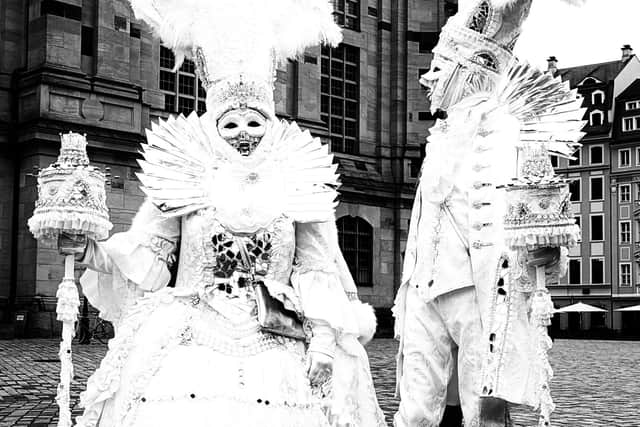 Two of the more strikingly attired carnival-goers