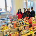 People are being asked to donate gifts which will be handed out at a local church as part of 'Susi's Christmas Appeal' (Susi is pictured on the far right).