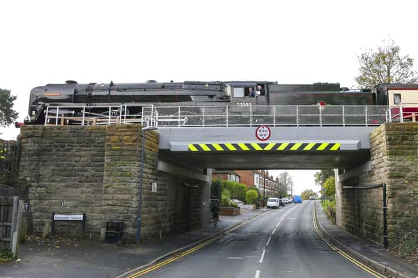 On November 26, the BR 4-6-2 Class 7MT No. 70000 Britannia, crossed the newly installed railway bridge in Rugby Road in Leamington. Photo by Peter Sumner