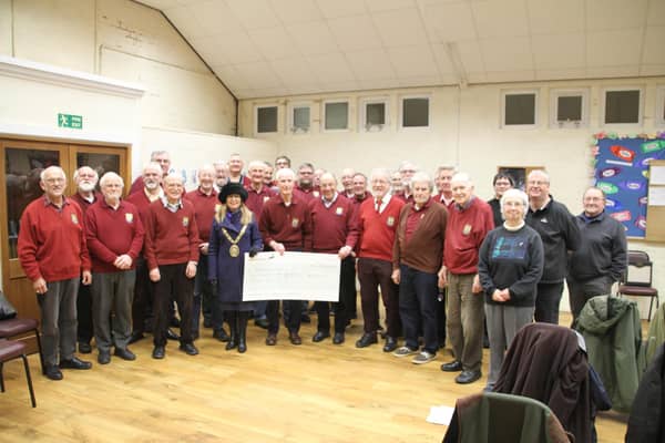 The Mayor of Rugby, Cllr Carolyn Watson-Merret, came along to the Rugby Male Voice Choir's (RMVC's) open rehearsal on Monday March 6 to accept the cheque for £683.70 for the foodbank.
