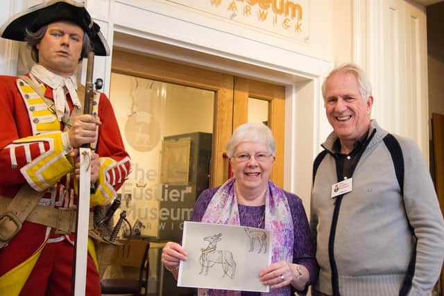 Janet Shaw, past president of the Warwick British Legion and judge for the competition, with Chris Kirby, general manager of the Fusiliers Museum. Janet named the winning entry 'Ready to march'. Photo by Gill Fletcher
