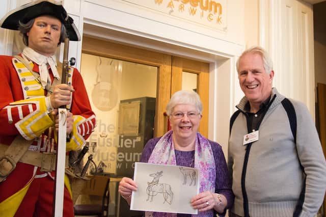 Janet Shaw, past president of the Warwick British Legion and judge for the competition, with Chris Kirby, general manager of the Fusiliers Museum. Janet named the winning entry 'Ready to march'. Photo by Gill Fletcher