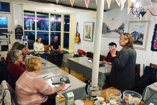 Artistic director Kate Saffin discusses the script for the show with the Braunston Writers Group which she runs, at a meeting in the village's community cafe.
