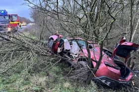 This Ferrari driver lost control on the wet road surface and crashed off the road into trees. Photo by OPU Warwickshire.