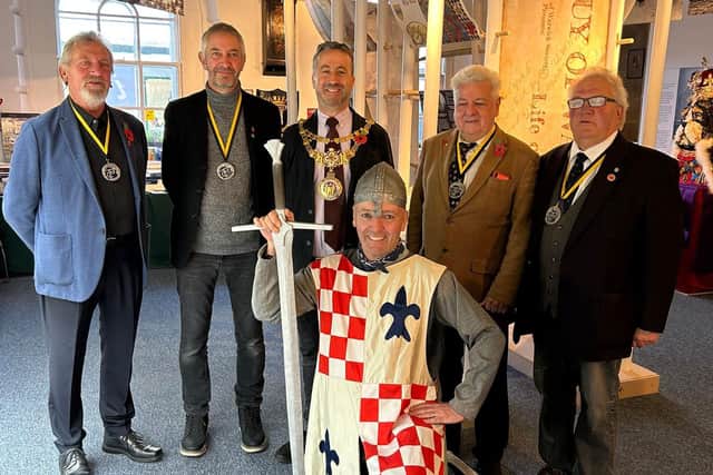 The Mayor of Warwick, Councillor Oliver Jaques, with members of the Guy of Warwick Society, from left to right in front of The Guy of Warwick exhibition. Tony Hemming, Peter Knell (Secretary), Councillor Oliver Jaques (Mayor of Warwick), Phil Baker (dressed as Guy), Chris Willsmore (Chairman), Tom Douglas. Photo credit: Mandy Littlejohn.