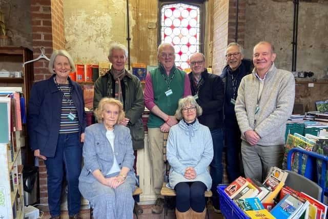 Volunteers in the bookshop at Baddesley Clinton . Credit: ©Alex Bunn