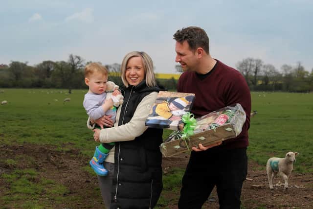 Lucy Humby, Fynn, and Dan Adams with the winning photograph. Photo supplied