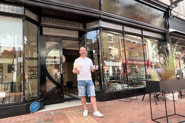 Nuova owner Wayne Tuton outside the iconic shopfront, with some of the smaller gift items in stock - and the outdoor seating also now in place.