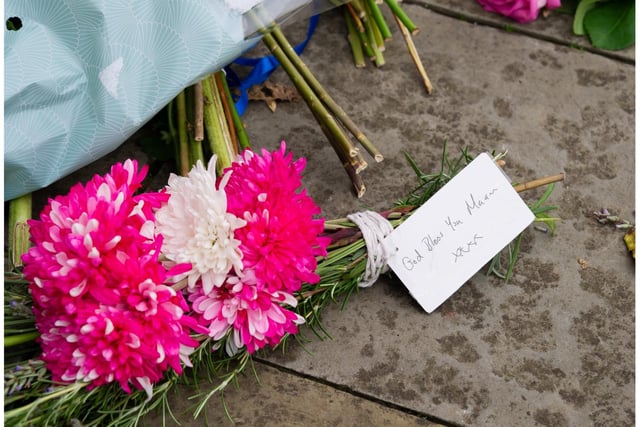 Floral tributes have been laid outside Shire Hall in Warwick. Photo by Mike Baker